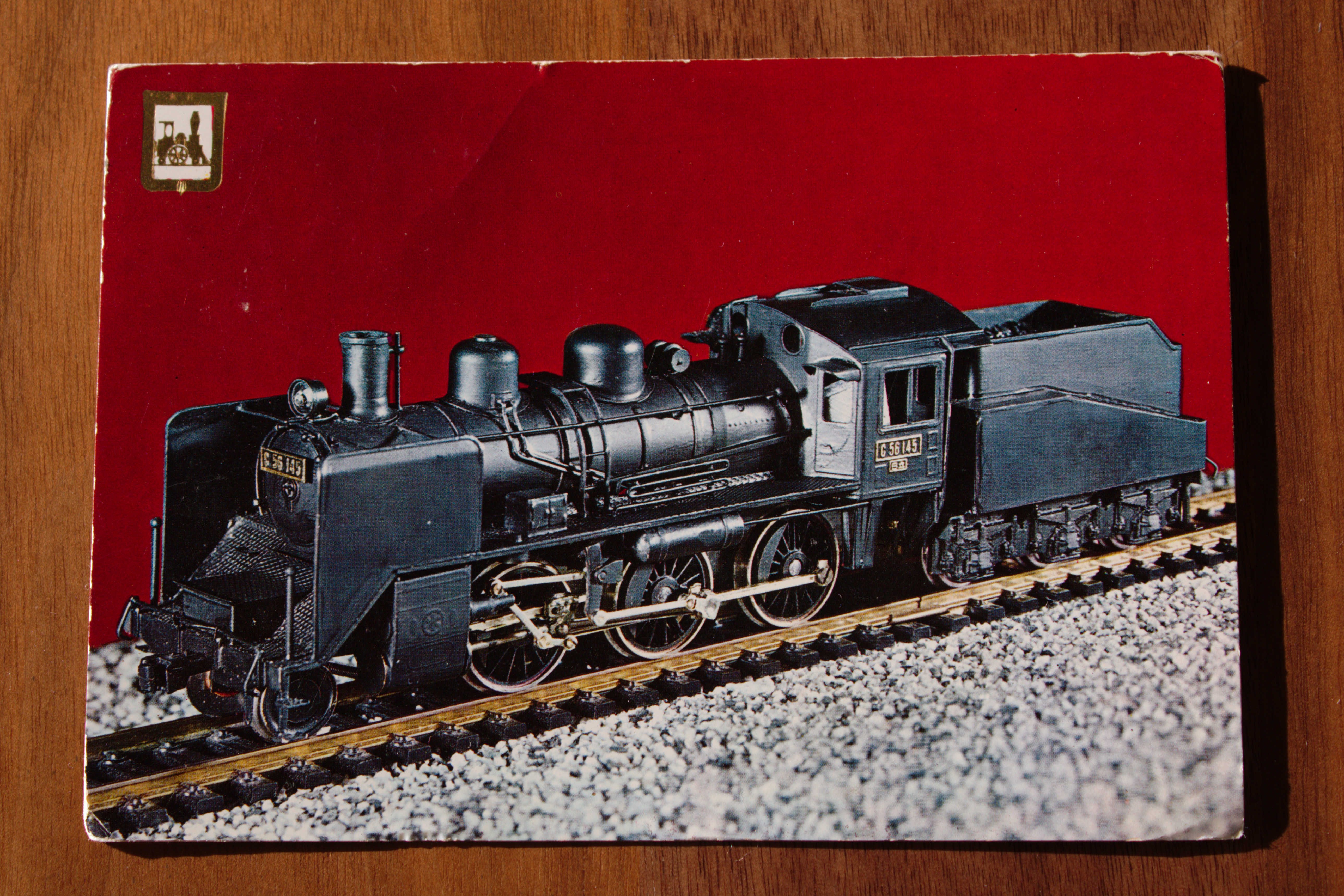 "The front of a postcard, showing a model train."
