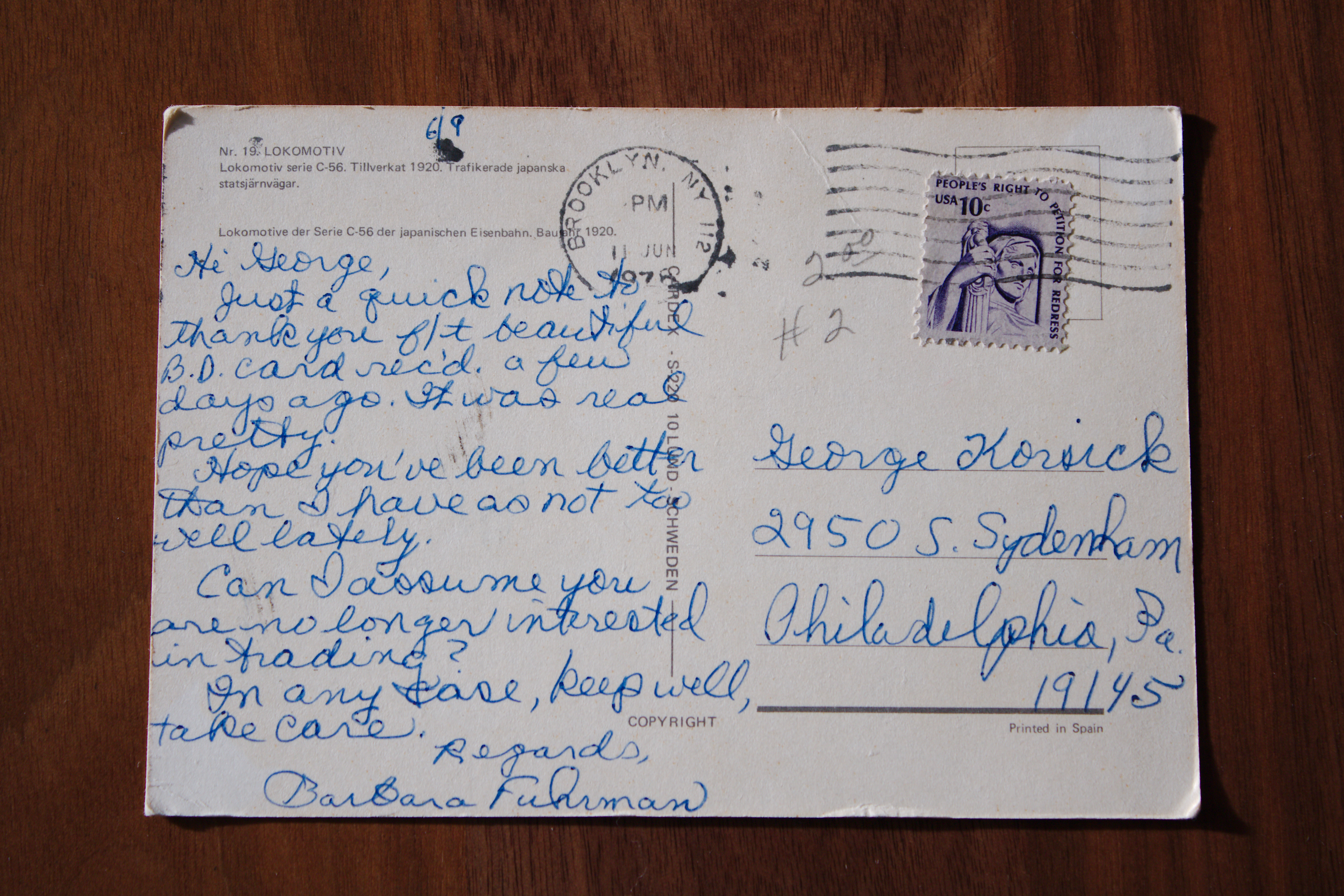 "The back of a postcard, showing a model train."